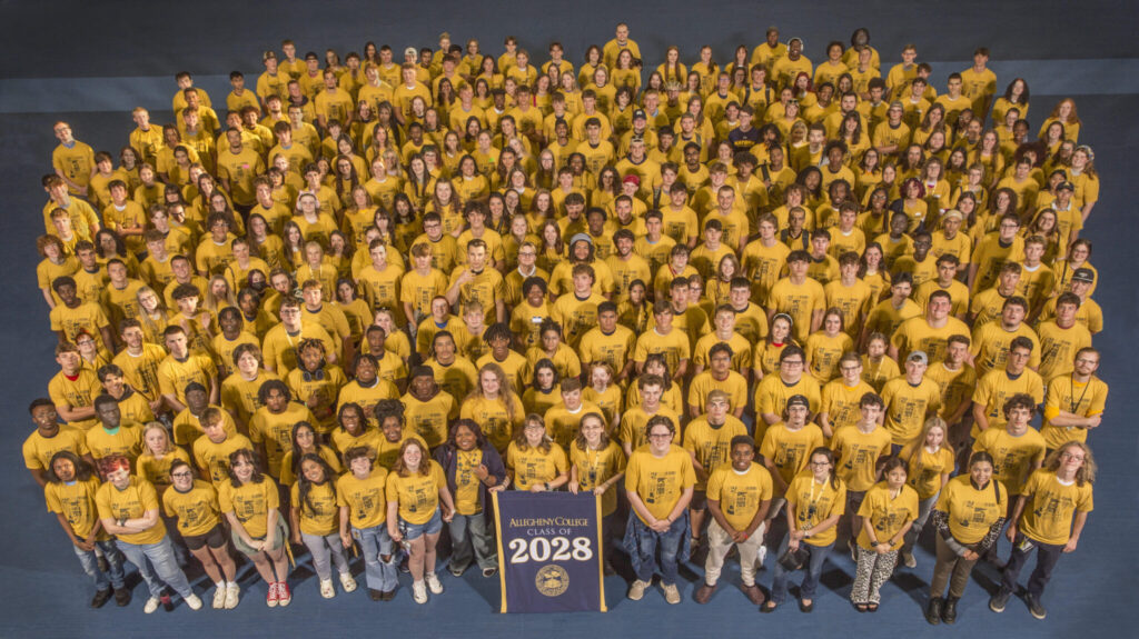 photo of all the first-year students together in matching gold shirts